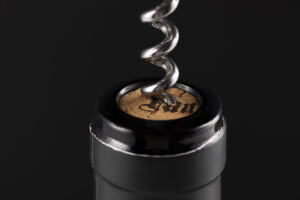 Wine bottle top with wine key opening cork. product branding image