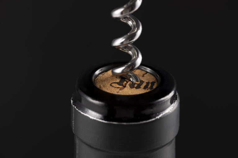 Wine bottle top with wine key opening cork. product branding image
